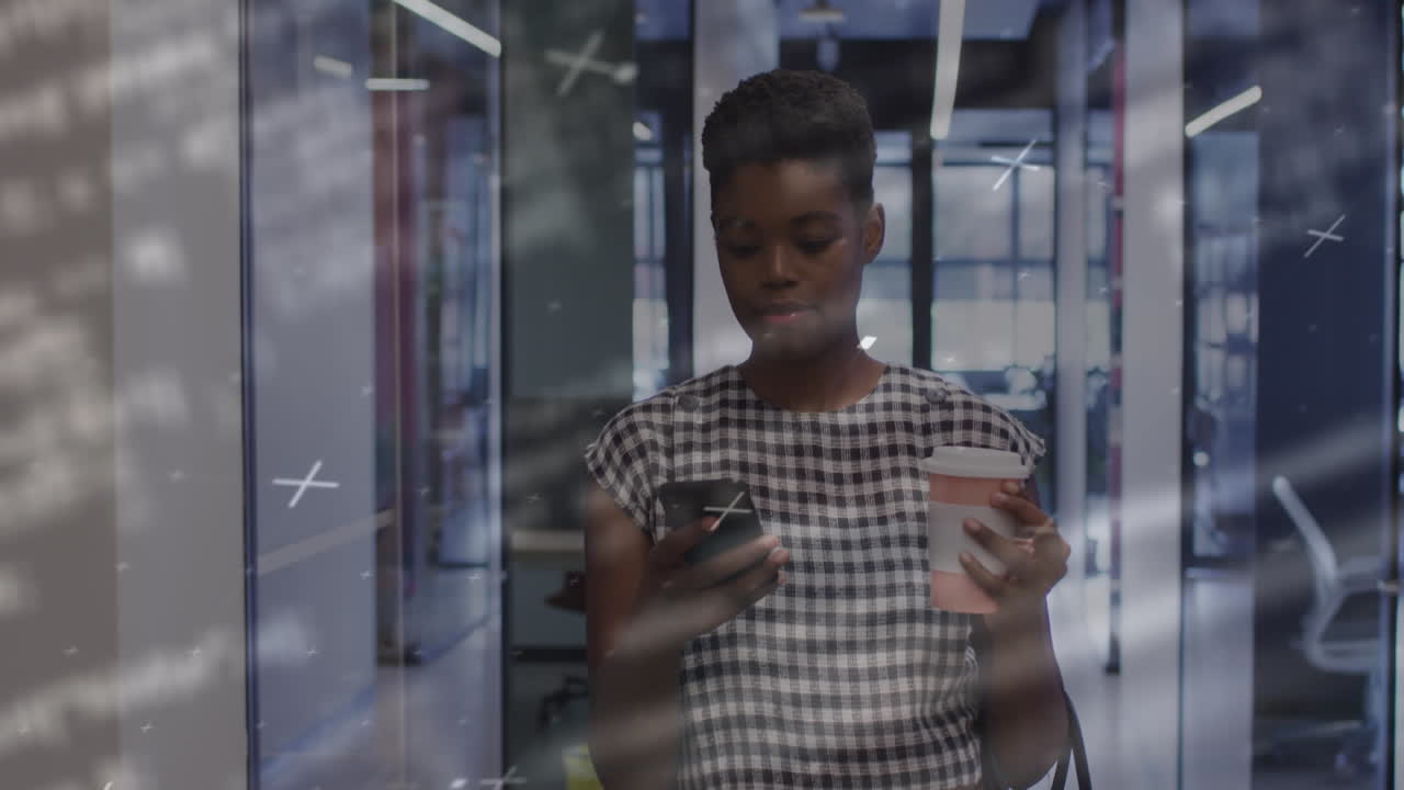 Animation of financial data processing over african american businesswoman using phone