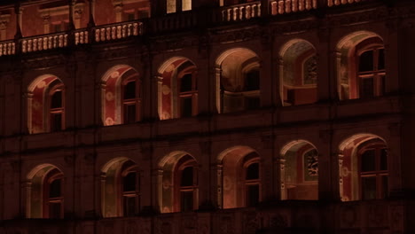 closeup view of windows of royal castle of blois, france. lighted corridor. night shot.