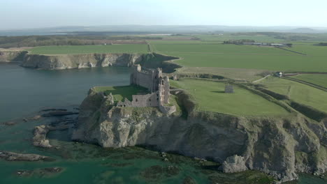 an aerial view of the inside of tantallon castle ruin on a sunny day, east lothian, scotland