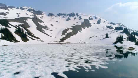 snow covered mountains and ice floating on the lake 4k