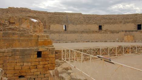 Close-up-of-Tarragona-roman-Amphitheatre-captured-in-a-4k-video-shoot-during-daylight-representing-Roman-ruins-next-to-the-sea-4k-tarragona-Amphitheatre-european-history