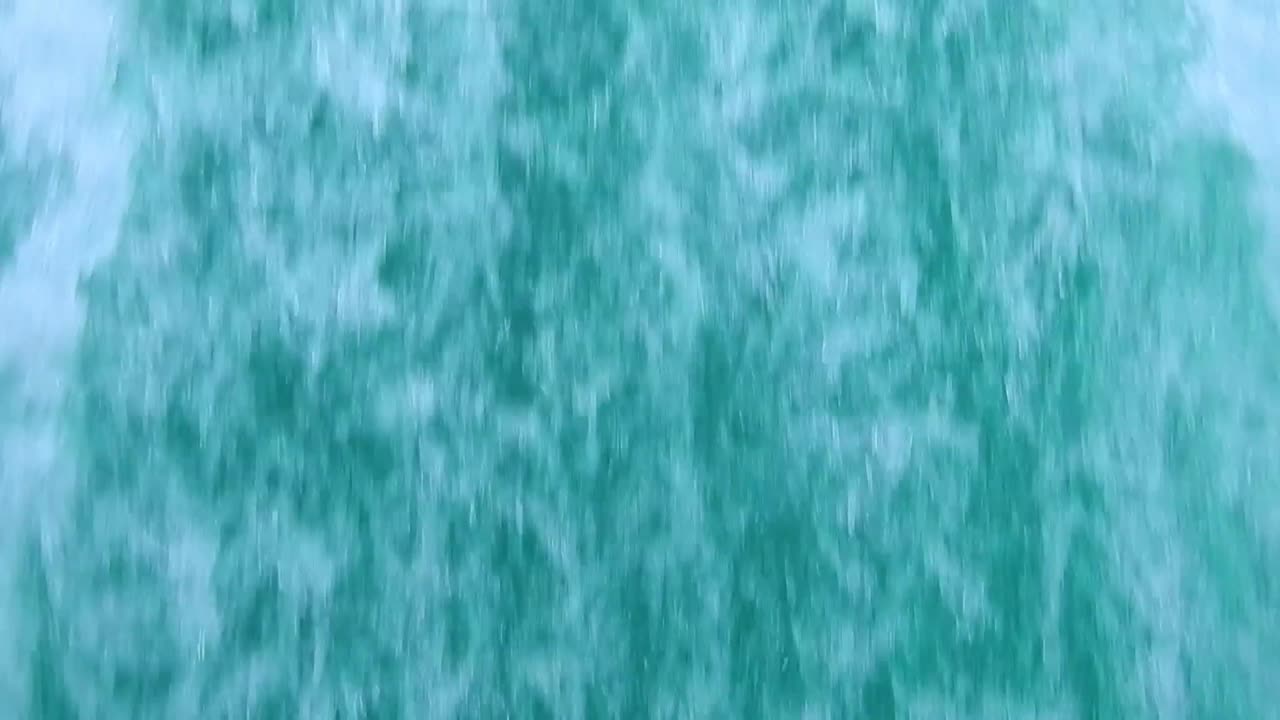 close up of  wake of water behind fast moving motor boat in a clear sky day,Blue sea , water surface.Destination vacation travel tropical ocean sea.Beautiful background .