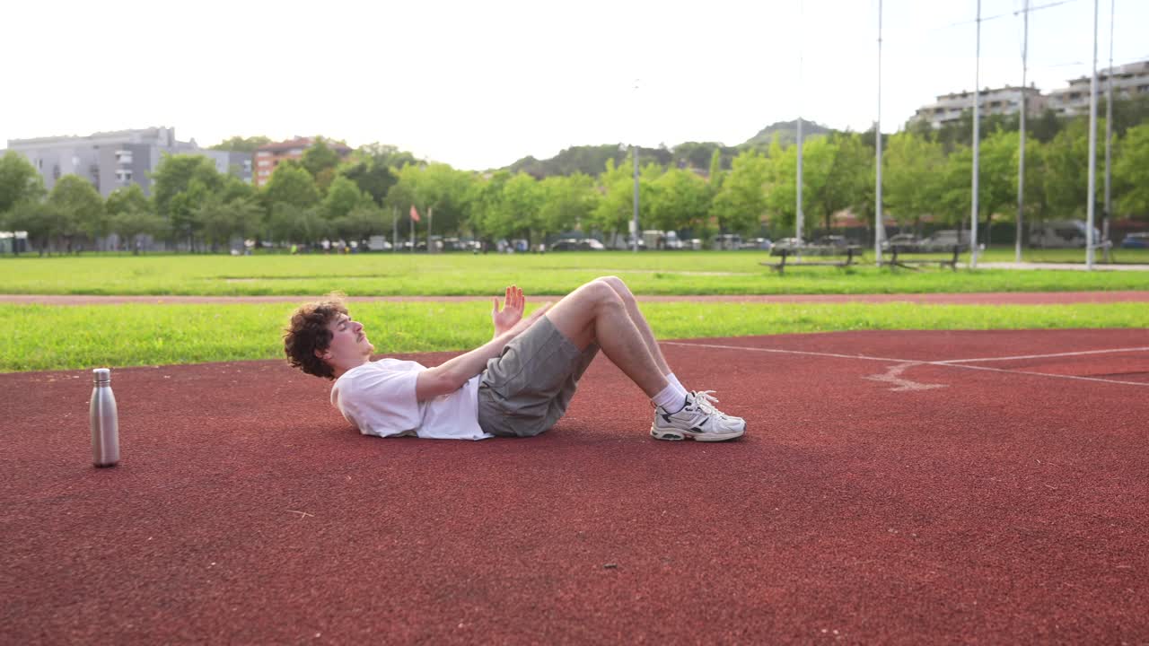 Man exercising on athletic field