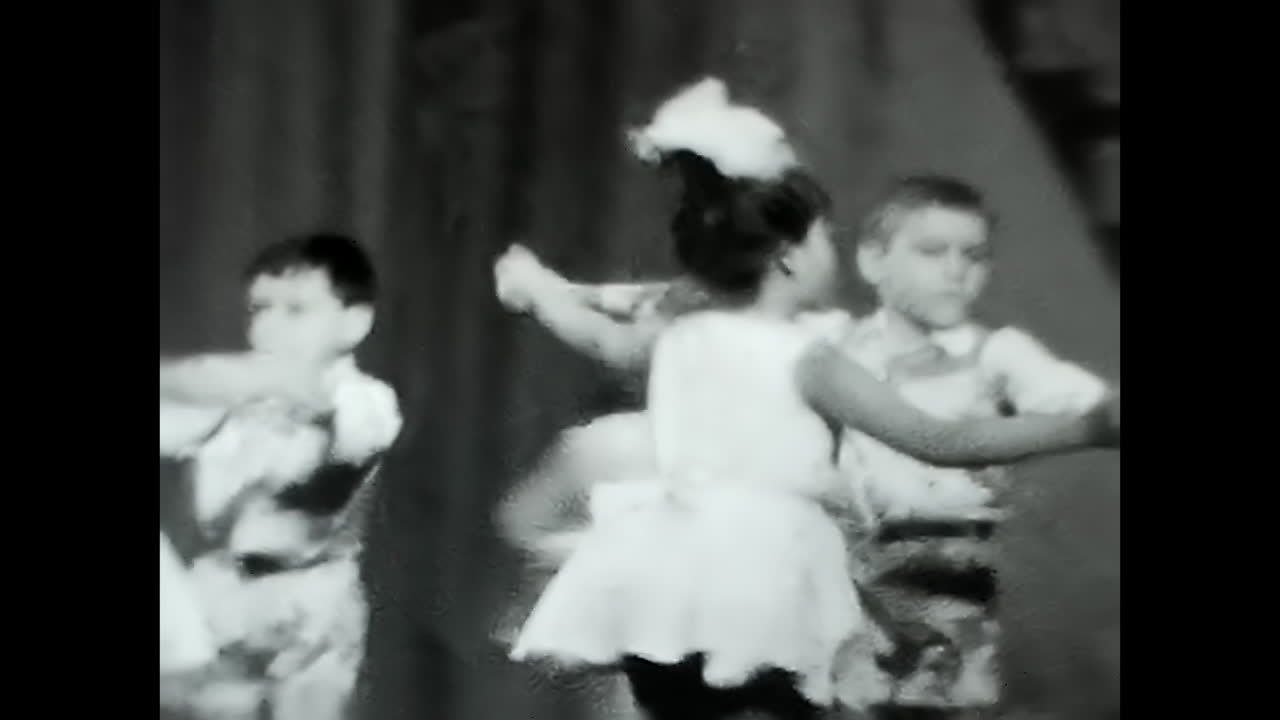 Children Standing in Front of Curtain at Soviet Union Exhibition. CIRCA USSR 1970: Young kids stand in front of a curtain at a Soviet Union exhibition, captivated by the history and culture.