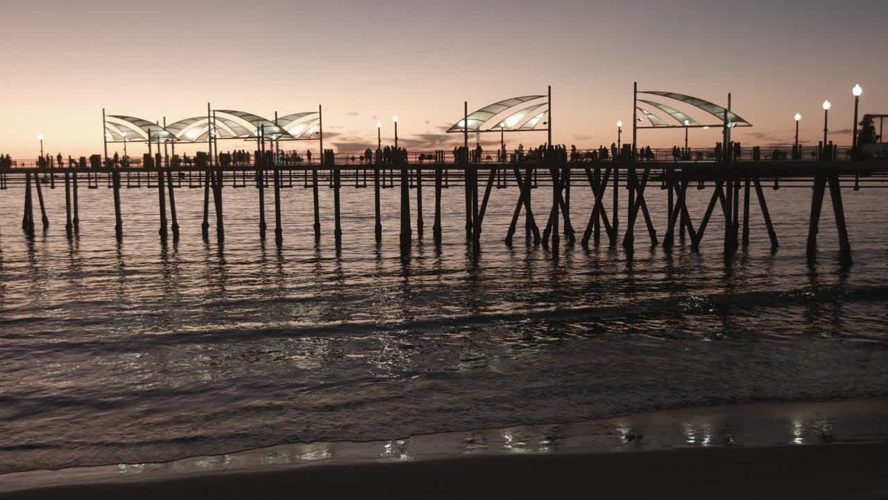 Cinematic wide shot of Redondo Beach Pier, stretching over the Pacific under golden sunset skies—perfect for tourism campaigns, travel stories, and showcasing California’s iconic coastal charm