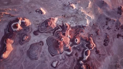 another planet landscape on earth, birdseye aerial view of striped sandstone rock formations in utah desert, usa