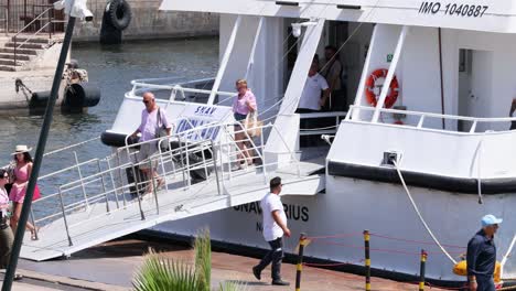 people boarding a ferry in sorrento, italy