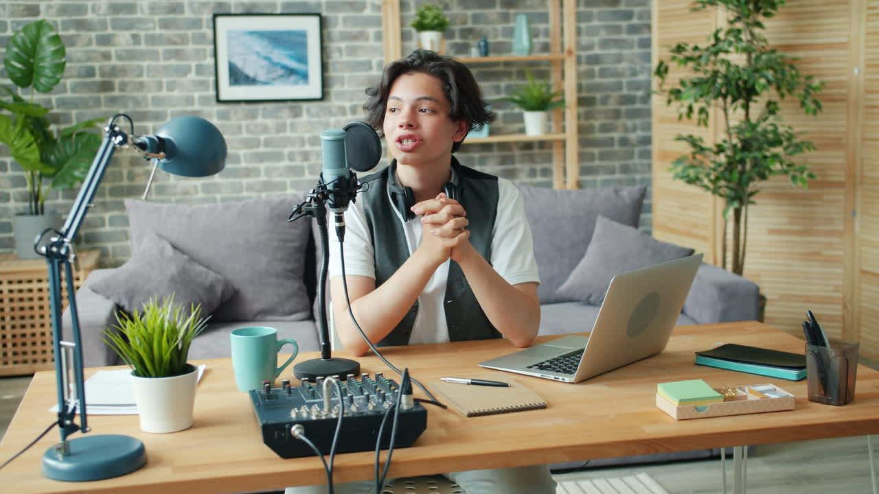 Young Man Recording Podcast in Home Studio