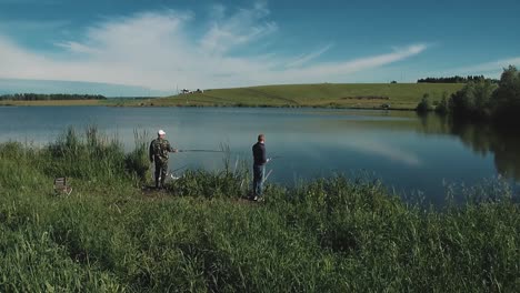 two young guys are fishing