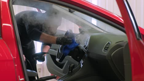 professional car cleaning. сar wash. interior detailing. dry clean and detail a car interior. deep seats cleaning. wiping foam in car wash. cleaning the car panel from dust. a vacuum cleaner