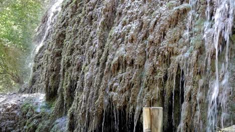 Rock-wall-covered-on-water-flow