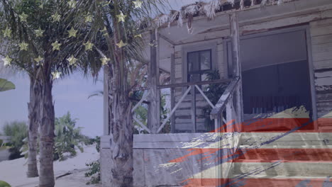 american flag animation over rustic beach house with palm trees