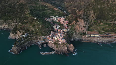 beautiful aerial shot of manarola in cinque terre, showing colorful buildings and coastline