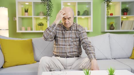 the old man who looks worried thinks and becomes restless.