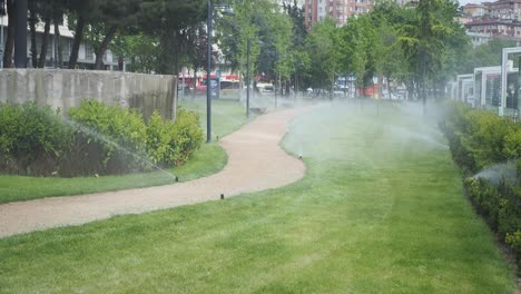 automated lawn sprinkler system in a city park