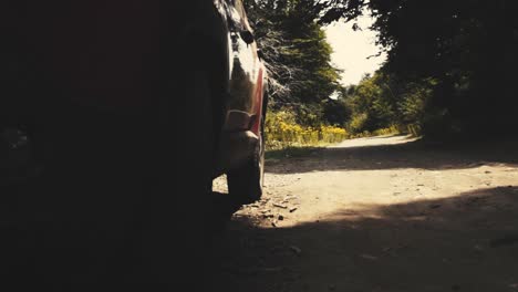 sliding movement on a country road with a car standing on the shore