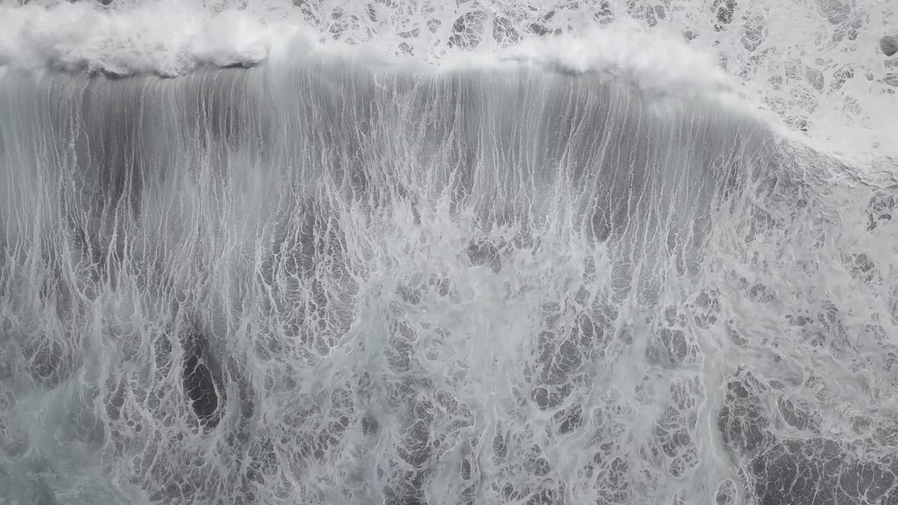 Scenic view of sea with foamy waves