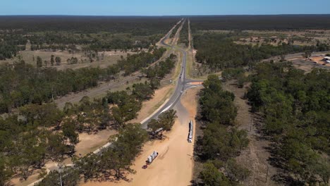 Right to left aerial views over Miles Queensland looking west over the Warrego Highway and a truck stop.