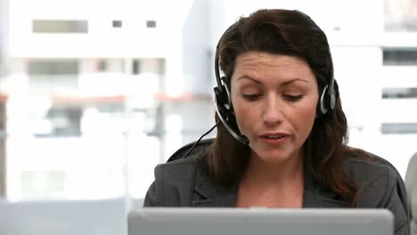 Unhappy-woman-talking-on-the-headphone