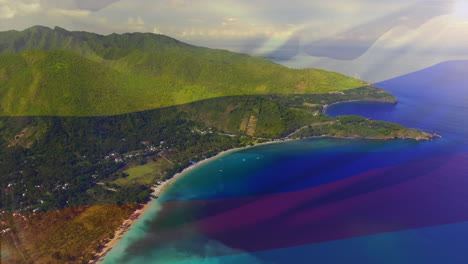 digital composition of waving columbia flag against aerial view of the sea