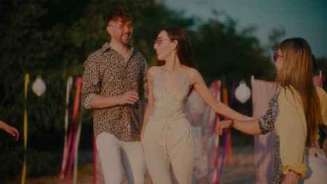 Confident-woman-walking-with-friends-embracing-her