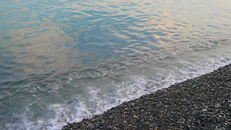 ocean waves on a pebble beach