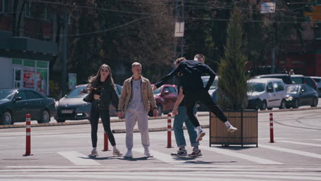 happy friends meeting at the street. group of young people having fun outdoors. guys enjoy their life together