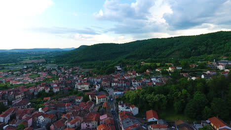 Drone-flying-above-Volvic,-toward-the-mountains