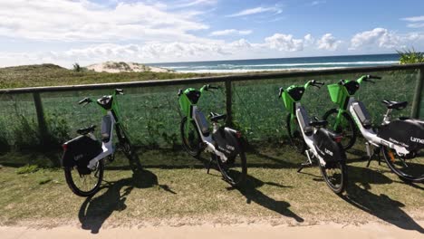 three bicycles parked near a scenic coastal path