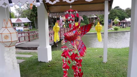 dancer in vibrant costume performing under pavilion.