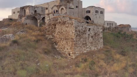 ancient stone structures and ruins in a dry landscape