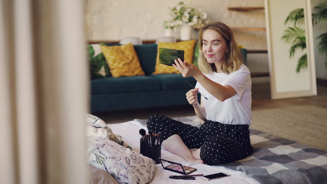 Woman Showing Makeup Product