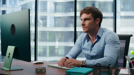 closeup nervous boss looking screen in office. stressed man tired of troubles