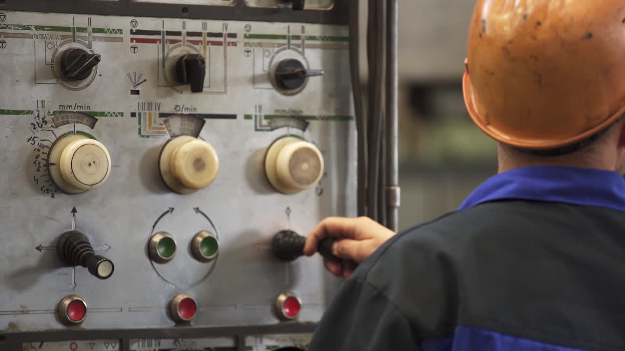 Worker Operating Industrial Machine