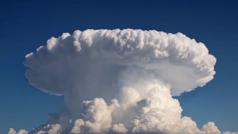 massive cumulus cloud formation in a clear blue sky