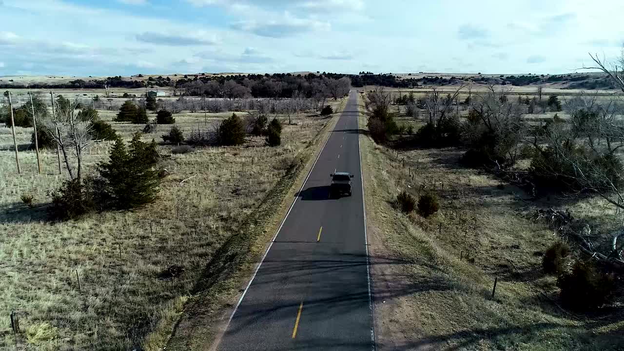 Truck Crossing over bridge that crosses over a river