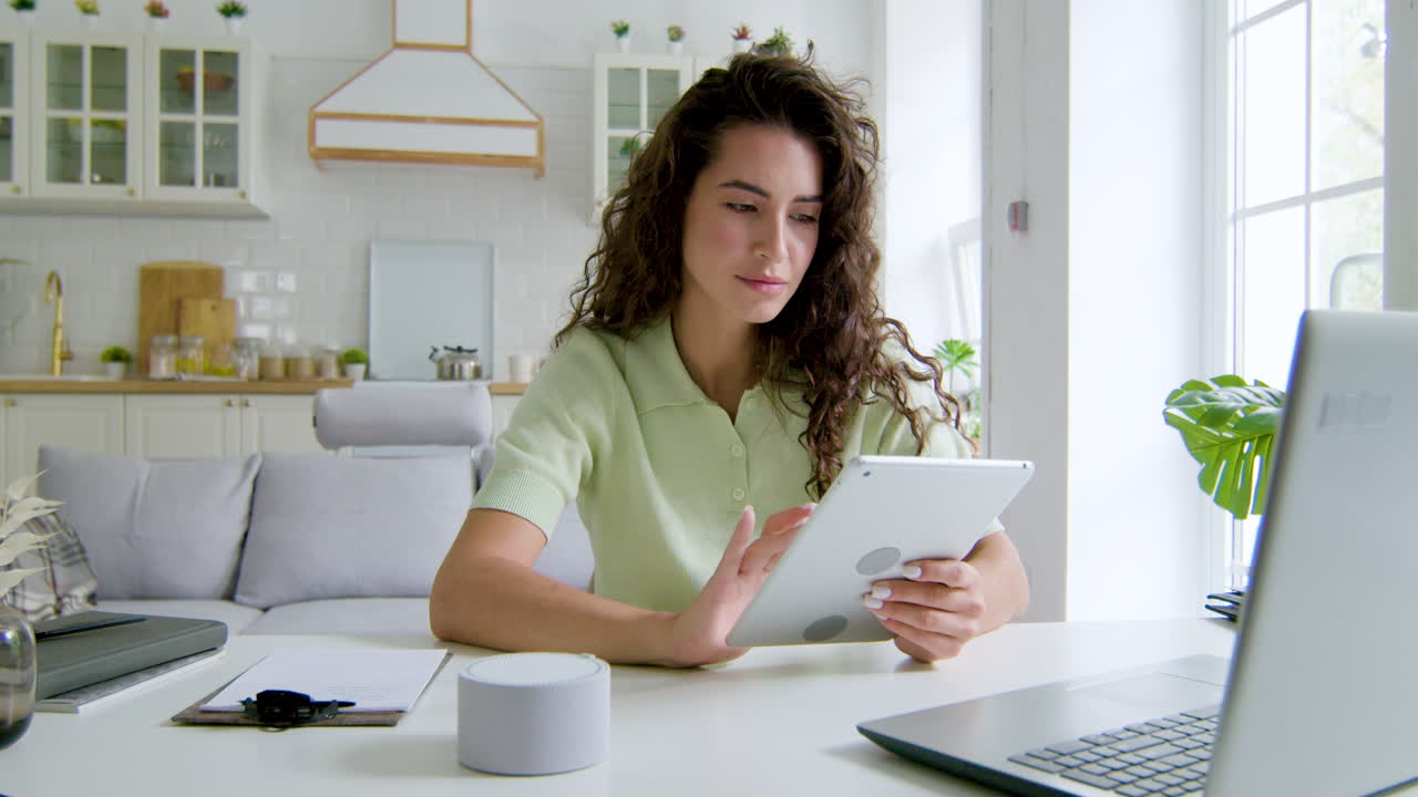 Woman sitting at desk in the living room