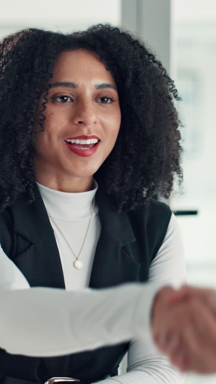 Smiling Businesswoman Shaking Hands in a Professional Setting