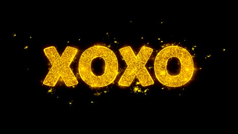 xo xo text sparks particles on black background.