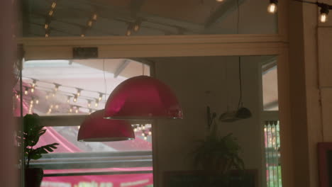 cozy restaurant interior with purple pendant lights