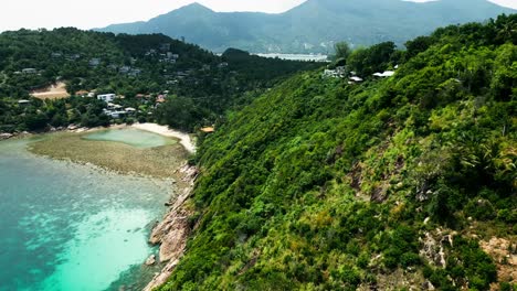 aerial fly above koh phangan islet secluded beach southeast asian travel destination establishing shot