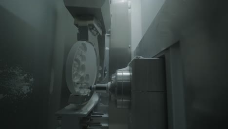 cnc machine cutting zirconia crowns from unfired zirconia