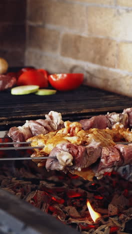 cooking meat on fire. grilling marinated meat on grill