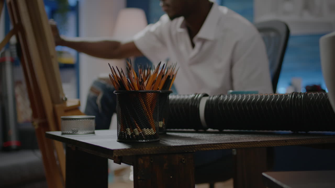 Close up of art tools on table in creative workshop studio