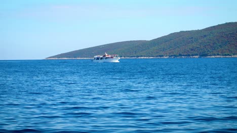 Ferry-Boat-Sailing-Across-The-Beautiful-Blue-Ocean-Under-Clear-Summer-Blue-Sky---Wide-Shot