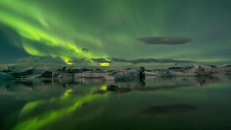 beautiful high acitivity northern lights on jokusarlon glacier lagoon - aurora borealis - south iceland - timelapse