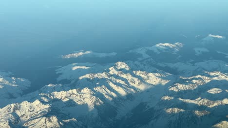 pyrenees mountains from a jet cockpit suring sunset