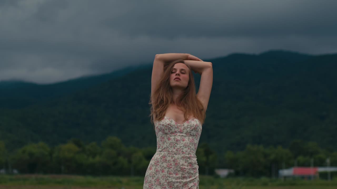 Woman in a Floral Dress, Mountain Landscape