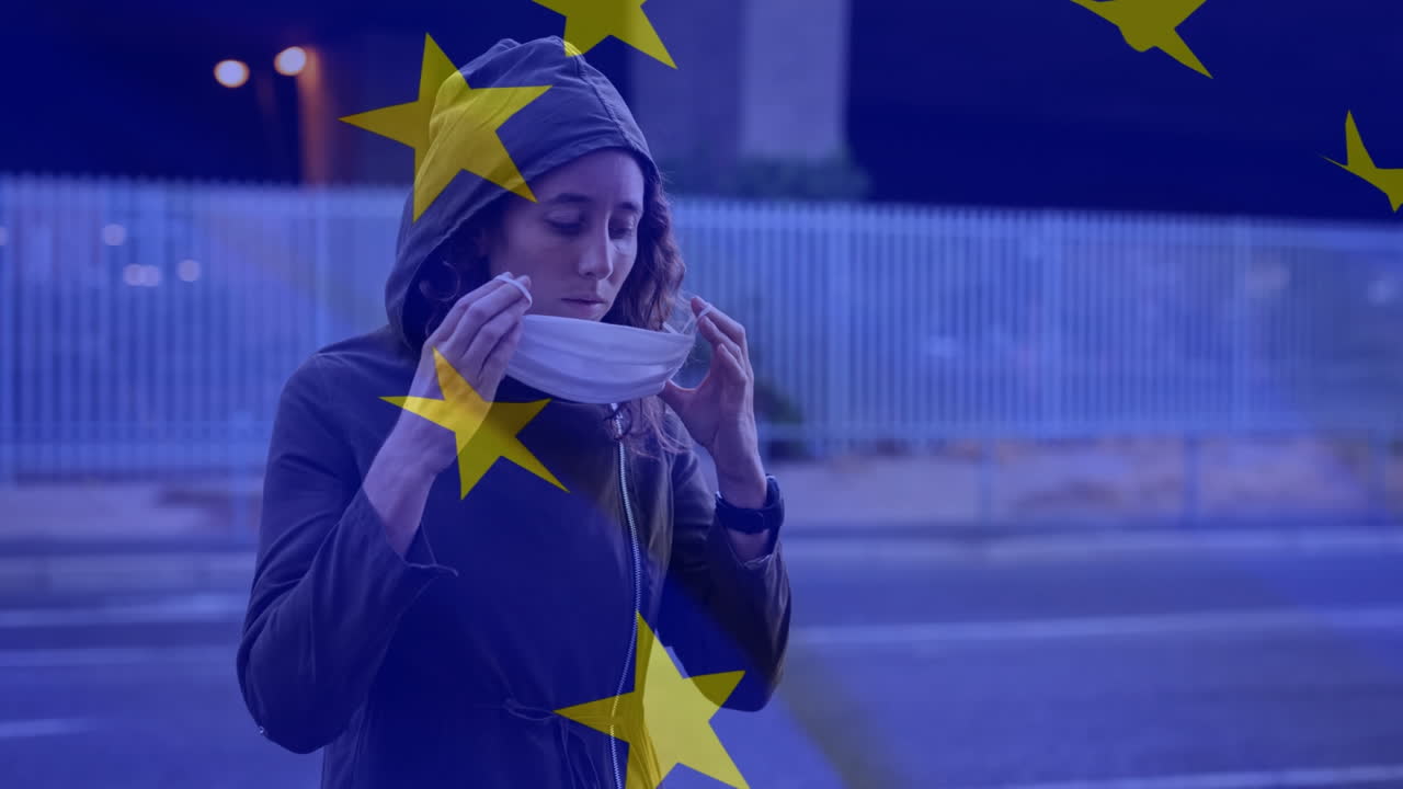 bandera de la ue ondeando contra una mujer con máscara facial