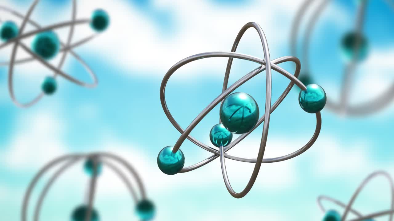 Animation of atom models spinning on blue background